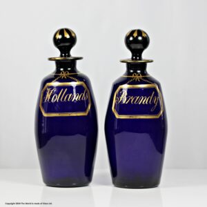Georgian pair of Bristol blue barrel shaped decanters