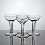 Matched set of four hollow stem glass champagne coupes