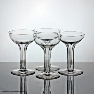 Matched set of four hollow stem glass champagne coupes