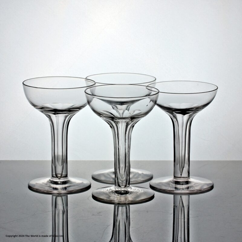 Matched set of four hollow stem glass champagne coupes