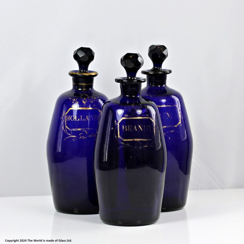 Georgian set of three Bristol blue gilded barrel-shaped decanters