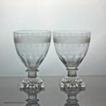 Georgian-style pair of engraved ovoid bowl rummers, lemon squeezer feet