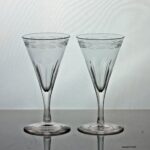 Georgian pair of engraved facet cut stem dram glasses