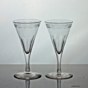 Georgian pair of engraved facet cut stem dram glasses