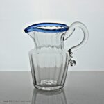 Georgian large panel-moulded cream jug with blue glass rim