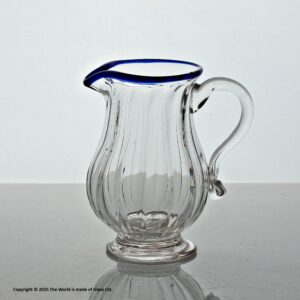 Georgian small panel-moulded cream jug with blue glass rim