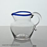 Georgian small plain bowl cream jug with blue glass rim
