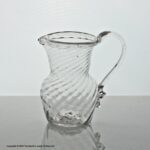 Georgian wrythen-moulded clear glass cream jug
