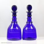 Victorian pair of Bristol blue three-ring decanters, bull's eye stoppers