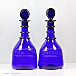 Victorian pair of Bristol blue three-ring decanters, bull's eye stoppers