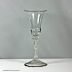 Georgian scarce double series opaque twist wine glass, triple knop