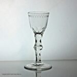 Georgian OXO-engraved facet cut knopped stem wine glass