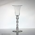 Georgian rare multi spiral air twist wine glass, four knops