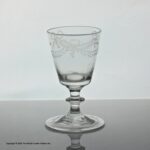Georgian swag and tail engraved bucket bowl dram glass with folded foot