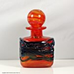 Mdina of Malta randomly strapped red glass bottle