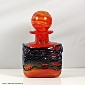 Mdina of Malta randomly strapped red glass bottle