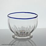 Georgian wrythen panel-moulded clear glass sugar bowl, blue glass rim