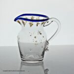 Georgian gilded clear glass cream jug, blue glass rim