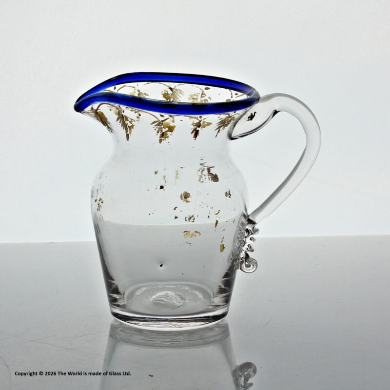 Georgian gilded clear glass cream jug, blue glass rim